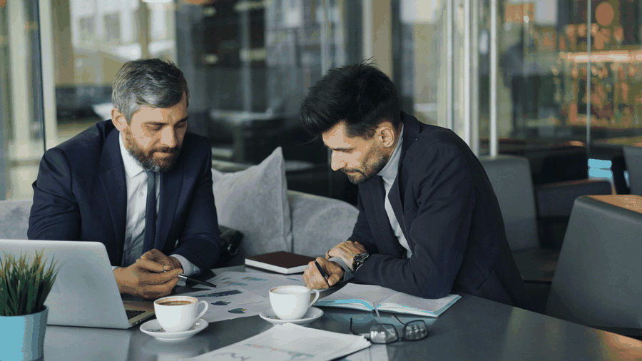 Team planning next steps for Business cash flow planning for service companies